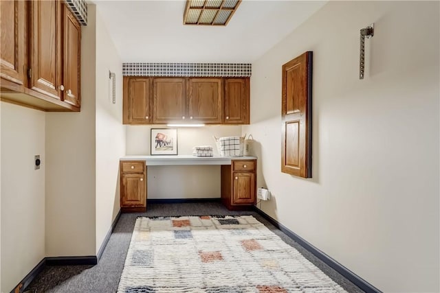 107 Fieldston Ter, Brighton, NY 14610 - home office with dark colored carpet and built in desk
