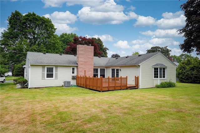 107 Fieldston Ter, Brighton, NY 14610 - rear view of house featuring a chimney, a wooden deck, and a lawn