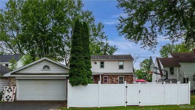 8652 Griffon Ave, Niagara Falls, NY 14304 - view of front of property featuring stone siding, driveway, and a garage