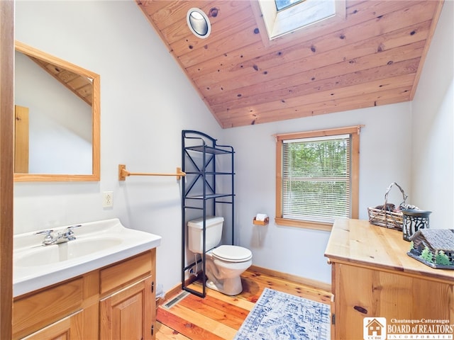 56 Heather Ln, Bradford, PA 16701 - bathroom with wood finished floors, vanity, lofted ceiling, and a skylight