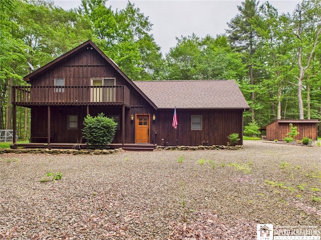 56 Heather Ln, Bradford, PA 16701 - chalet / cabin featuring roof with shingles, a shed, a deck, and gravel driveway