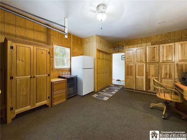 56 Heather Ln, Bradford, PA 16701 - kitchen featuring freestanding refrigerator, brown cabinets, dark carpet, light countertops, and a ceiling fan