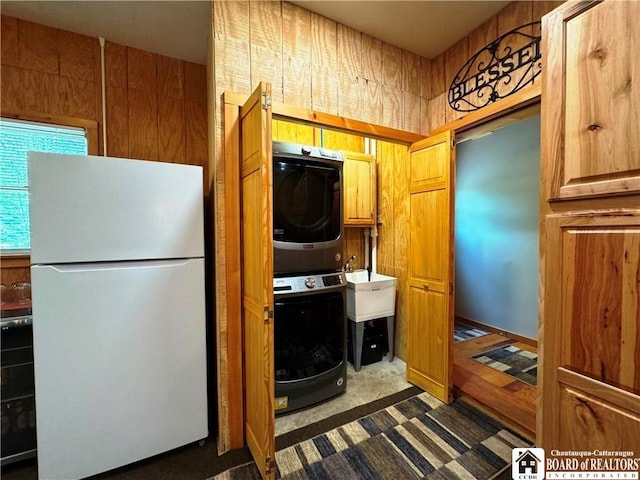 56 Heather Ln, Bradford, PA 16701 - washroom featuring stacked washer / drying machine and dark carpet
