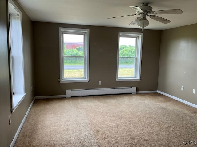 12853 Fuller Rd, Adams, NY 13606 - empty room with baseboard heating, healthy amount of natural light, carpet floors, and ceiling fan