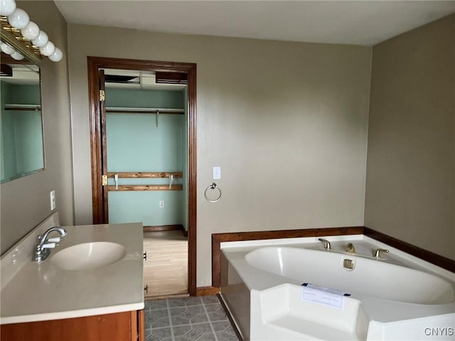 12853 Fuller Rd, Adams, NY 13606 - full bathroom featuring vanity, a garden tub, and tile patterned flooring