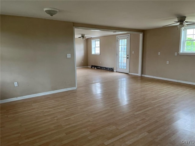 12853 Fuller Rd, Adams, NY 13606 - spare room featuring a ceiling fan, light wood-style floors, and a baseboard heating unit