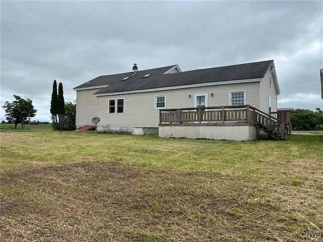 12853 Fuller Rd, Adams, NY 13606 - rear view of house featuring a wooden deck and a lawn