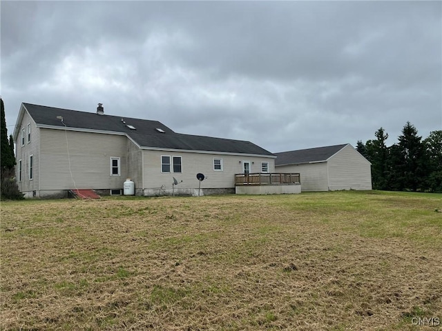 12853 Fuller Rd, Adams, NY 13606 - rear view of property featuring a deck and a lawn