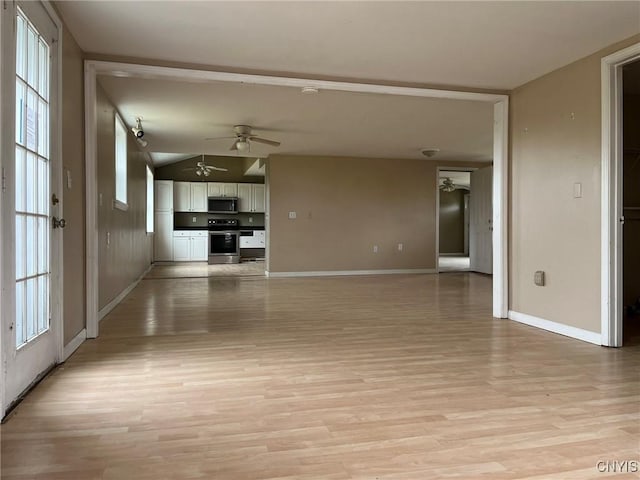 12853 Fuller Rd, Adams, NY 13606 - unfurnished living room with a ceiling fan, light wood-type flooring, and lofted ceiling