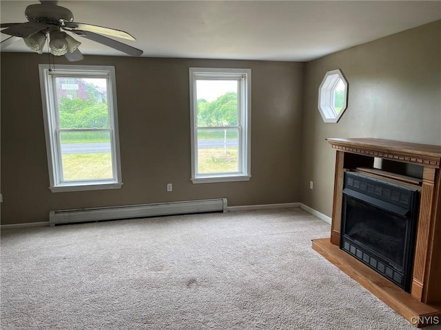 12853 Fuller Rd, Adams, NY 13606 - unfurnished living room featuring baseboard heating, a ceiling fan, and carpet flooring