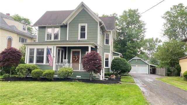 41 Maple Ave, Hamburg, NY 14075 - view of front of house featuring a detached garage, an outdoor structure, a front yard, roof with shingles, and covered porch