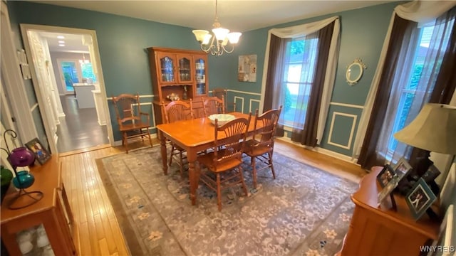 41 Maple Ave, Hamburg, NY 14075 - dining area with a chandelier, plenty of natural light, and wood finished floors