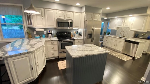 41 Maple Ave, Hamburg, NY 14075 - kitchen featuring stainless steel appliances, a peninsula, white cabinetry, light stone countertops, and recessed lighting