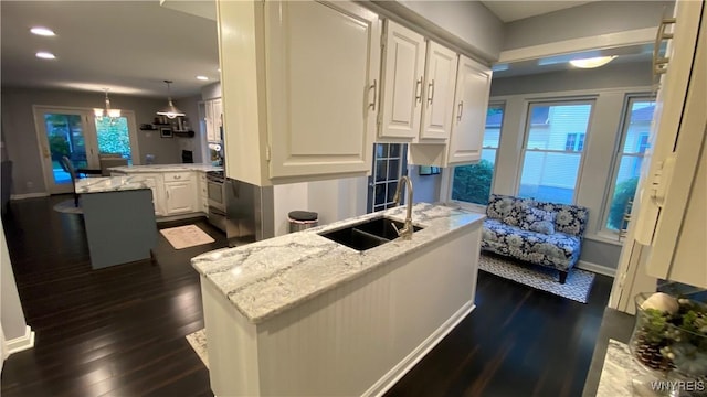 41 Maple Ave, Hamburg, NY 14075 - kitchen featuring a peninsula, dark wood finished floors, white cabinets, light stone countertops, and recessed lighting