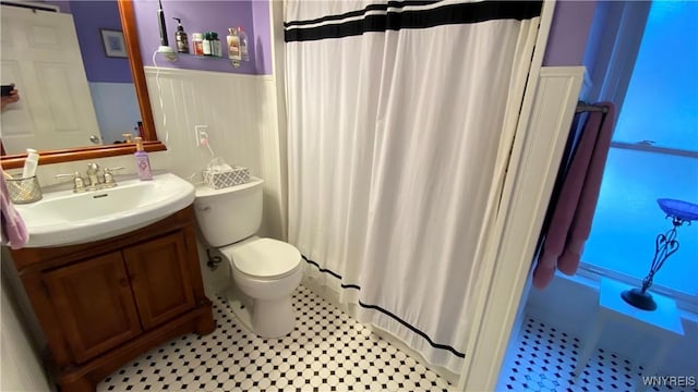41 Maple Ave, Hamburg, NY 14075 - full bathroom featuring a wainscoted wall, vanity, and a shower with shower curtain