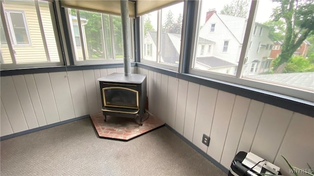 41 Maple Ave, Hamburg, NY 14075 - unfurnished sunroom with plenty of natural light and a wood stove