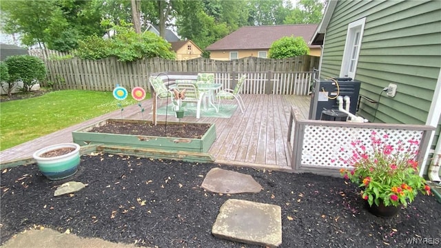 41 Maple Ave, Hamburg, NY 14075 - deck featuring a fenced backyard, outdoor dining area, and a vegetable garden
