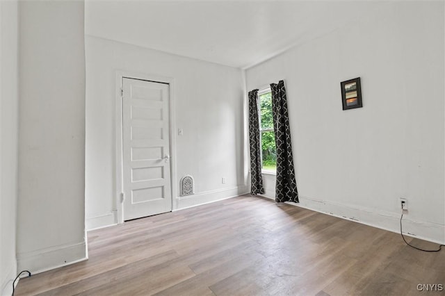 905-07 Tallman St, Syracuse, NY 13204 - unfurnished room featuring wood finished floors and baseboards
