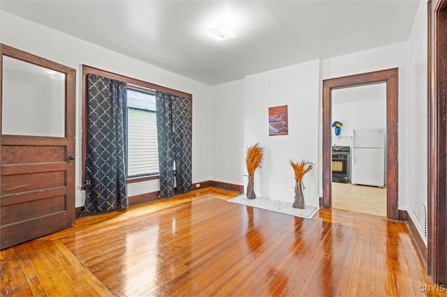905-07 Tallman St, Syracuse, NY 13204 - unfurnished room featuring hardwood / wood-style flooring and baseboards