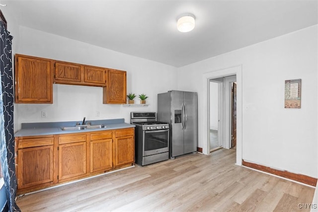 905-07 Tallman St, Syracuse, NY 13204 - kitchen featuring stainless steel appliances, light wood-style floors, light countertops, and brown cabinetry
