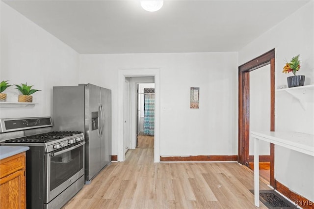 905-07 Tallman St, Syracuse, NY 13204 - kitchen featuring stainless steel gas range, light wood-style floors, and light countertops