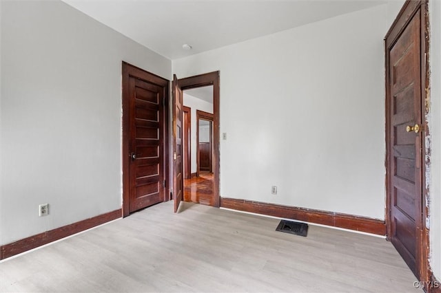 905-07 Tallman St, Syracuse, NY 13204 - unfurnished room with light wood-type flooring and baseboards