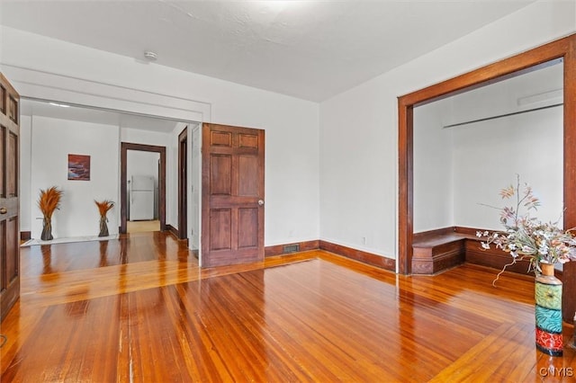 905-07 Tallman St, Syracuse, NY 13204 - spare room featuring hardwood / wood-style floors and baseboards