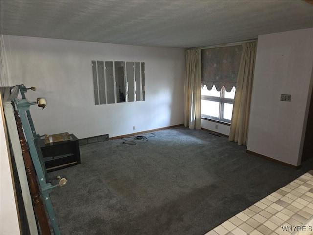 2595 Jerauld Ave, Niagara Falls, NY 14305 - unfurnished living room with carpet flooring and baseboards