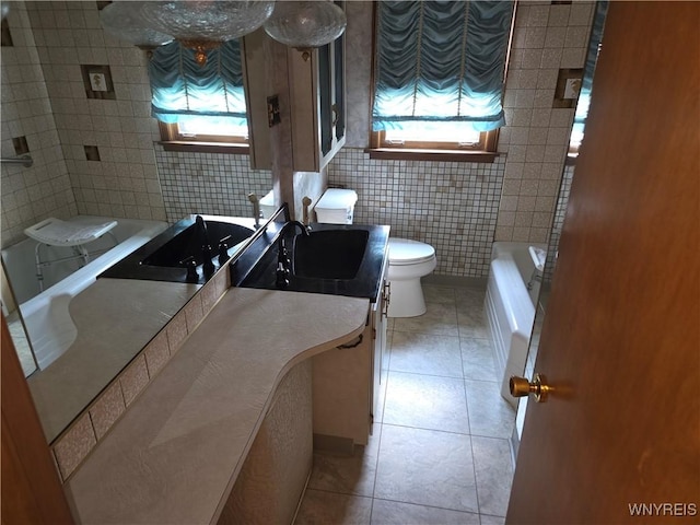 2595 Jerauld Ave, Niagara Falls, NY 14305 - full bath with tile patterned floors, vanity, and tile walls