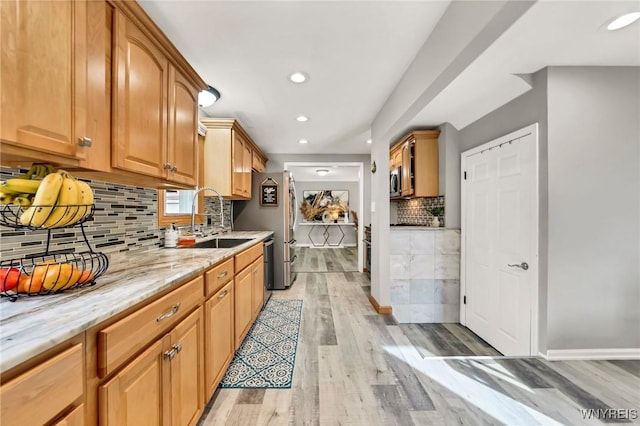 48 Meaford Rd, Cheektowaga, NY 14215 - kitchen with light wood-style floors, light stone counters, recessed lighting, decorative backsplash, and stainless steel microwave