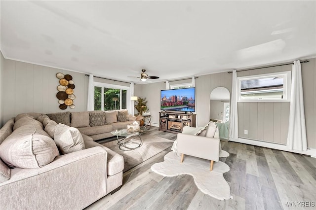 48 Meaford Rd, Cheektowaga, NY 14215 - living room with wood finished floors, a ceiling fan, and arched walkways