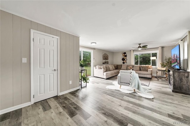 48 Meaford Rd, Cheektowaga, NY 14215 - living area with wood finished floors, a ceiling fan, and a decorative wall