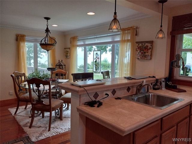 9802 Shorecliff Rd, Evans, NY 14006 - kitchen featuring tile counters, decorative light fixtures, wood finished floors, crown molding, and recessed lighting