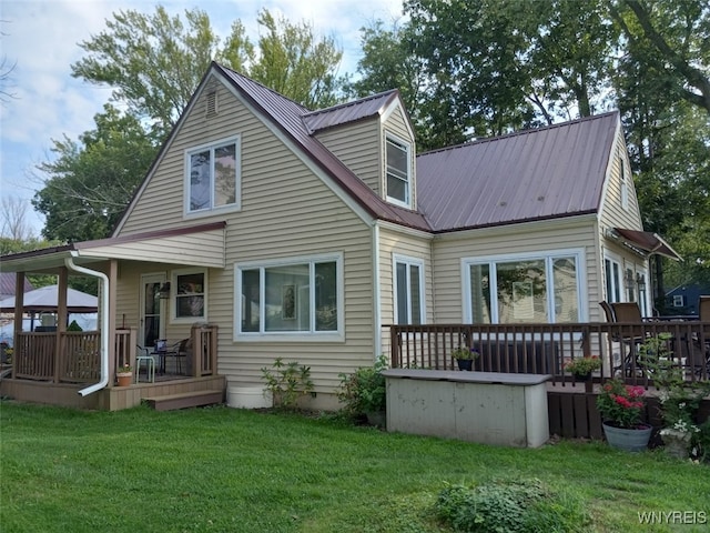 9802 Shorecliff Rd, Evans, NY 14006 - rear view of house with a yard, a metal roof, and a deck