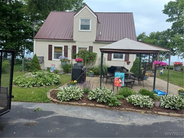 9802 Shorecliff Rd, Evans, NY 14006 - view of front of house featuring a gazebo, a patio, and a metal roof