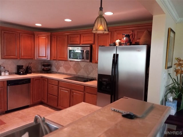 9802 Shorecliff Rd, Evans, NY 14006 - kitchen with stainless steel appliances, light countertops, backsplash, hanging light fixtures, and recessed lighting