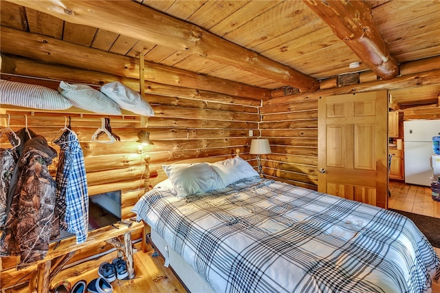 661 Lewis Rd, Meredith, NY 13806 - bedroom with freestanding refrigerator, a wooden ceiling with exposed beams, light wood-style flooring, and log walls
