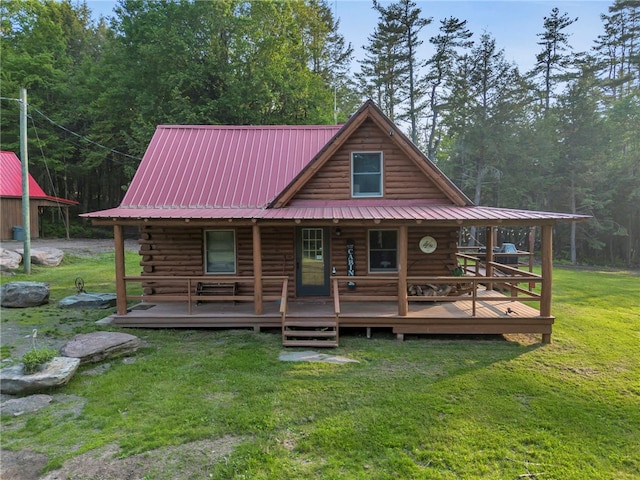 661 Lewis Rd, Meredith, NY 13806 - view of front of house featuring log exterior, a front yard, and a metal roof