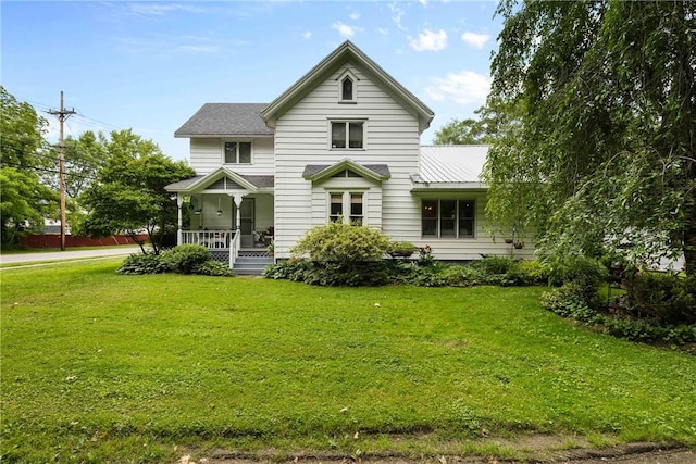 639 Plank Rd, Penfield, NY 14580 - view of front of house with a porch and a front lawn