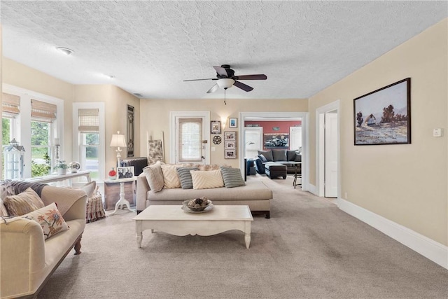 639 Plank Rd, Penfield, NY 14580 - carpeted living room with a ceiling fan and a textured ceiling