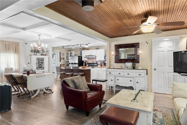 639 Plank Rd, Penfield, NY 14580 - living area with a chandelier, ceiling fan, wood finished floors, and a wood ceiling with exposed beams