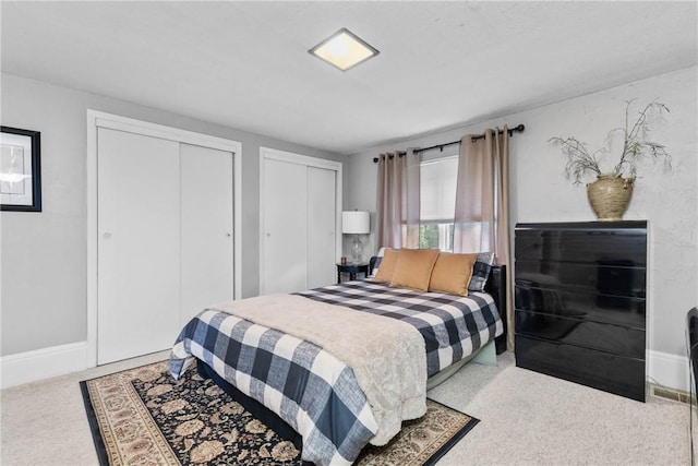 639 Plank Rd, Penfield, NY 14580 - carpeted bedroom with two closets and baseboards