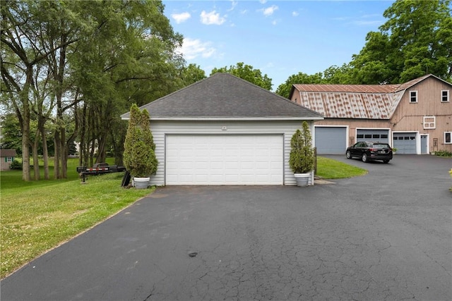 639 Plank Rd, Penfield, NY 14580 - view of side of home featuring a yard, asphalt driveway, and roof with shingles