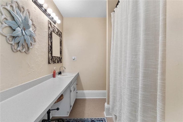 639 Plank Rd, Penfield, NY 14580 - bathroom with vanity, tile patterned floors, and curtained shower