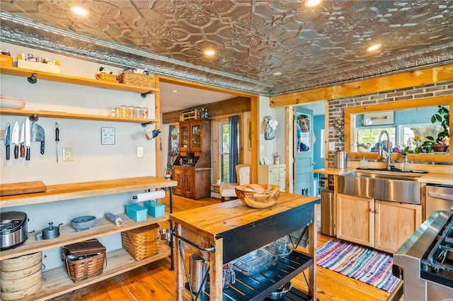 258 E State St, Albion, NY 14411 - kitchen with an ornate ceiling, hardwood / wood-style flooring, open shelves, butcher block counters, and crown molding
