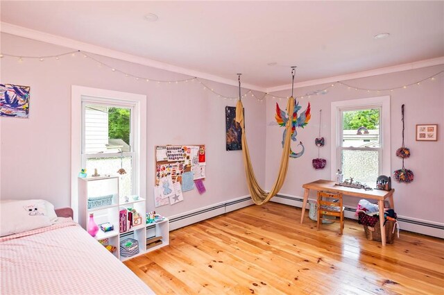 258 E State St, Albion, NY 14411 - bedroom with multiple windows, light wood-style flooring, and a baseboard radiator