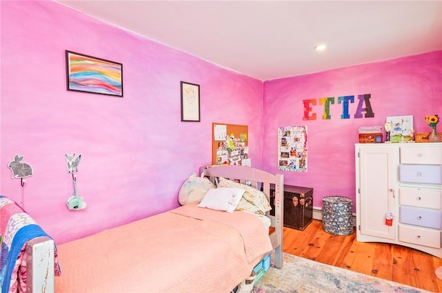 258 E State St, Albion, NY 14411 - bedroom with light wood-style floors and baseboard heating