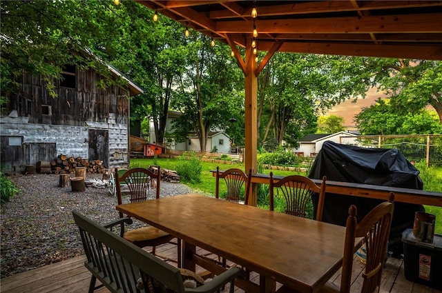 258 E State St, Albion, NY 14411 - deck at dusk featuring outdoor dining space and area for grilling
