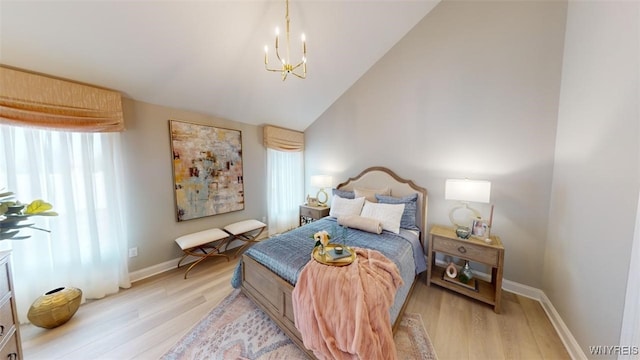37A Stonham Pl, Amherst, NY 14221 - bedroom featuring a chandelier, light wood-type flooring, and vaulted ceiling