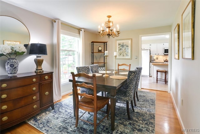 92 Bridle Path, Amherst, NY 14221 - dining space with a chandelier, light wood-style floors, and plenty of natural light